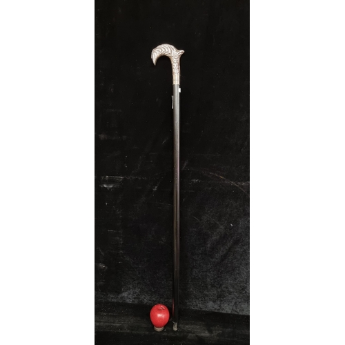 192 - A handsome walking cane with white metal handle featuring organic relief detailing.