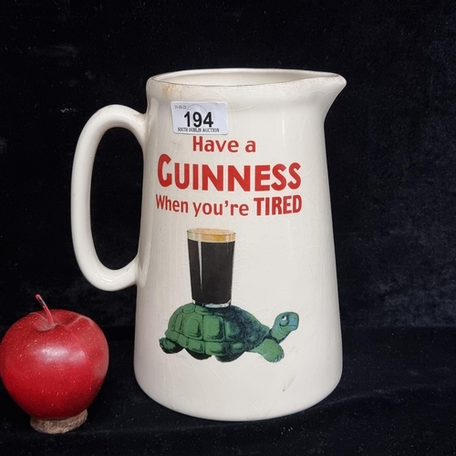 194 - A large pitcher advertising Guinness reading 