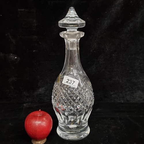 237 - A Waterford Crystal decanter in the Colleen pattern with a faceted stopper and acid mark to base. In... 