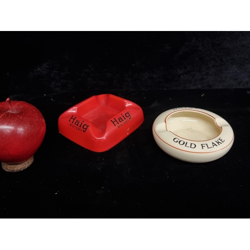 245 - Two vintage ceramic ash trays including a Carlton Ware example advertising Haig Whisky along with an... 