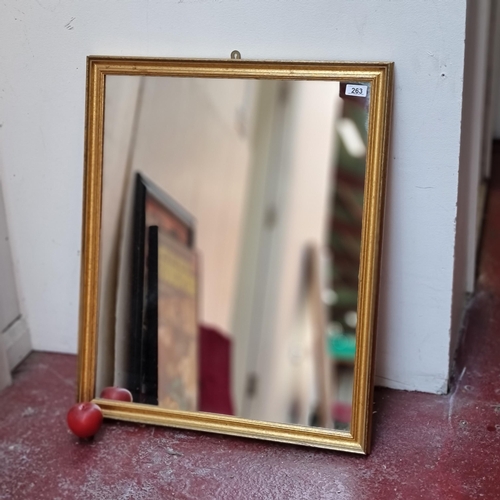 263 - A nicely proportioned rectangular wall mirror with gilt frame. In Good order.