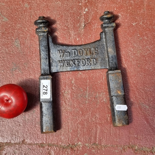 278 - A very heavy cast metal book scraper reading Wm Doyle Wexford. A nice example.