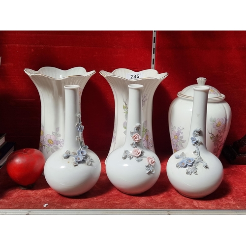 285 - Three pieces of Royal Tara fine bone china including two vases and a lidded jar. Along with three bu... 