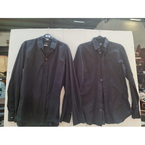 298 - Two men's long sleeved black shirts by the designer Dolce & Gabbana, one example with pleated detail... 