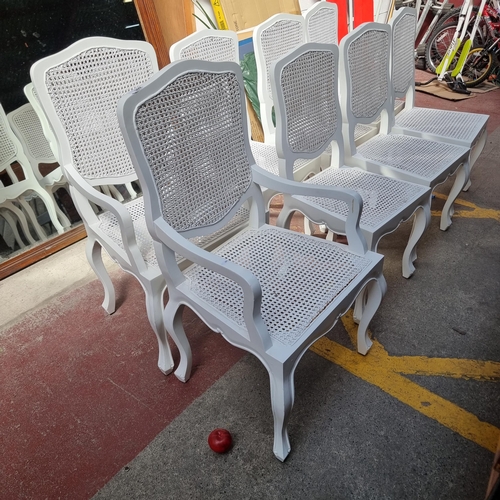 309 - Star lot : A set of eight handsome dining chairs including two carvers, all with rattan seats and ba... 