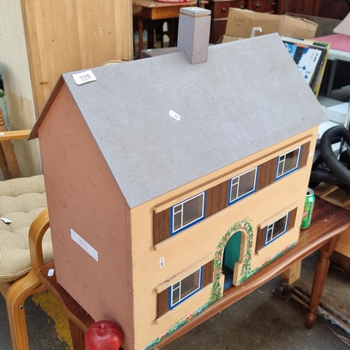 328 - An adorable vintage doll's house with beautiful hand painted facade. Inside holds six rooms includin... 