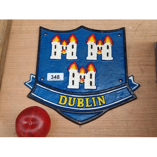 348 - A cast metal wall plaque depicting the Dublin City crest.