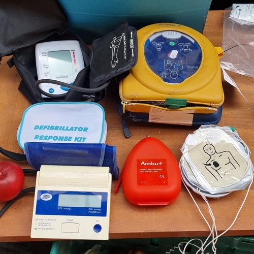 355 - A collection of 8 medical equipment items including defibrillators by brands such as Samaritan Pad a... 