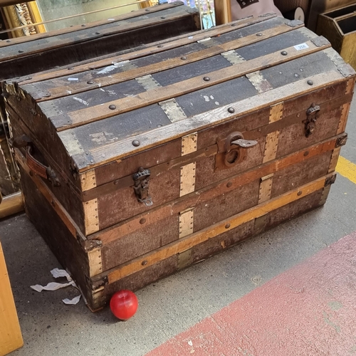 358 - A fabulous large antique domed top steamer trunk with leather exterior and metal fittings. H52cm x L... 