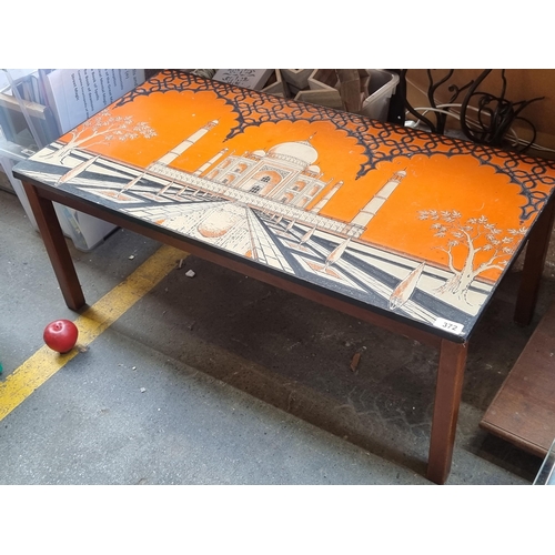 372 - Star Lot : A fantastic vintage coffee table with a lacquered top in striking palette of orange, blac... 