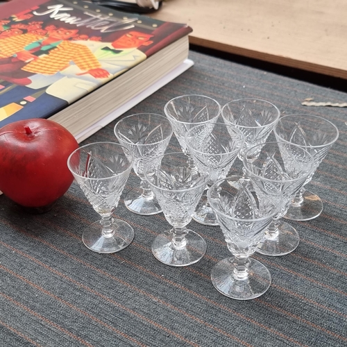 381 - Nine small stemmed Waterford Crystal liquer glasses in the Mooncoin pattern.