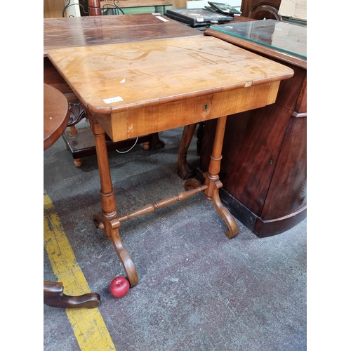 393 - Star lot : A very elegant golden satinwood antique sewing table with deep pull-out drawer. Supported... 