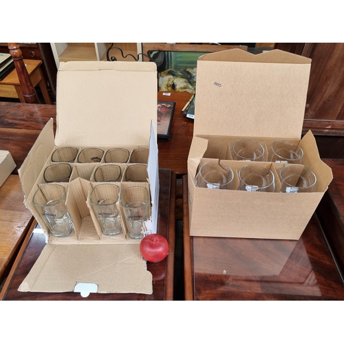 396 - Two boxes of branded drinking glasses. Including a set of five Bombay Sapphire gin balloon glasses w... 