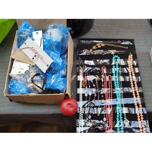 399 - A large quantity of costume jewellery, most of which is brand new old stock in original packaging. I... 