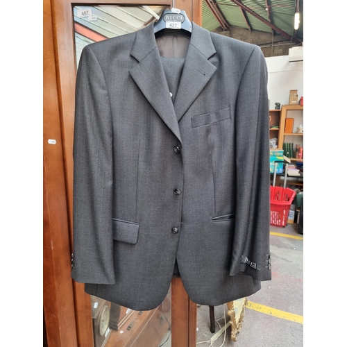 427 - A very smart 100% virgin wool Aldo Ricci two piece suit in a slate grey with subtle red pinstripe an... 