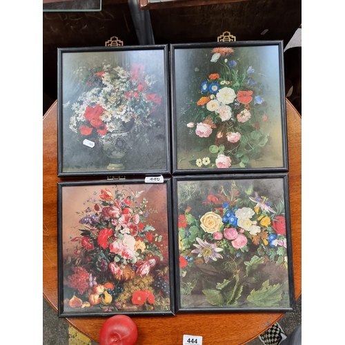 446 - Four prints showing bountiful bouquets of flowers. Housed in vintage black frames with brass wall fa... 