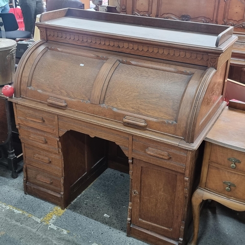 496 - Star Lot - A striking antique solid oak writing desk with a drop down shutter to top to reveal nine ... 