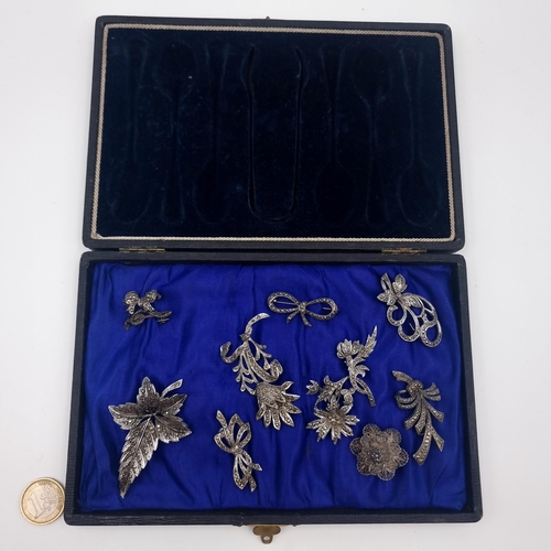 502 - A beautifully presented collection of ten vintage Marcasite brooches, including stunningly crafted f... 