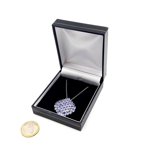 547 - A fabulous example of a Tanzanite stone pendant, featuring 50 beautifully matched natural stones and... 