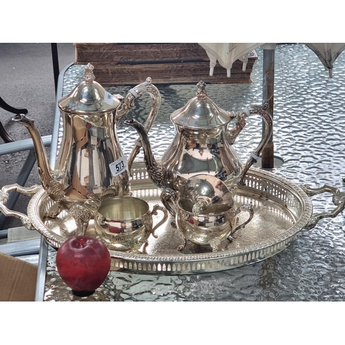 573 - A beautiful silver plated tea set consisting of teapot, coffee pot, sugar bowl and creamer all held ... 