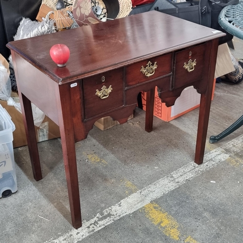 575 - Star Lot : A charming antique console table with three drawers to front with ornate brass drop pull ... 