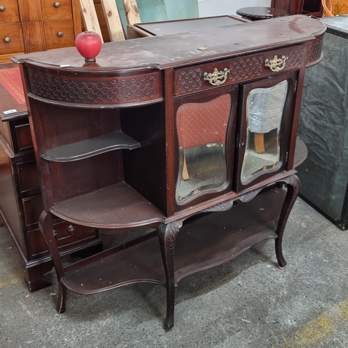 580 - A nice looking serpentine front credenza with cupboard to centre with beveled mirrored doors, drawer... 