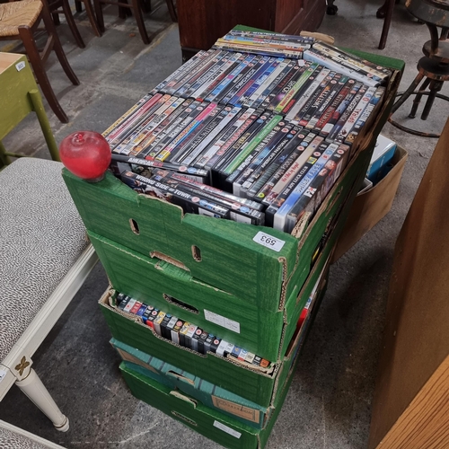 593 - Five large boxes filled with DVD's of all genres. Almost 350 DVD's, something for everyone to watch.