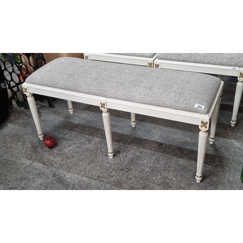 596 - A striking empire style bench with soft brown and cream pattern upholstery and empire style wooden b... 