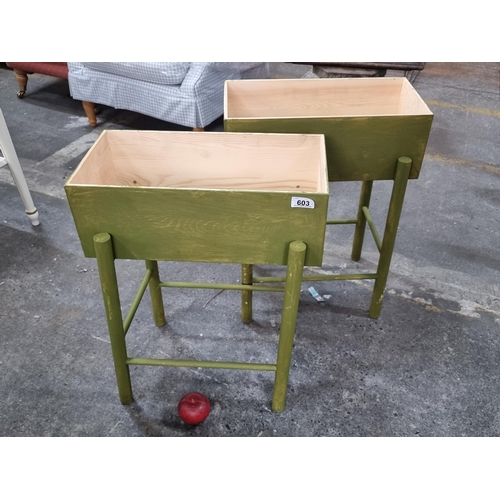 603 - Two charming wooden floor standing box planters in a lime green finish.