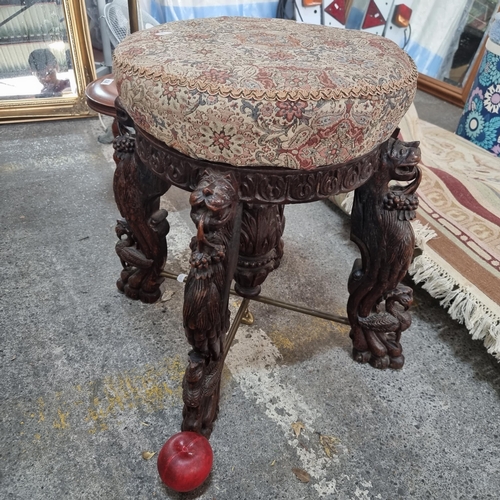 635 - Star Lot - A beautiful Anglo-Indian rosewood stool. An expertly carved example with figural legs for... 