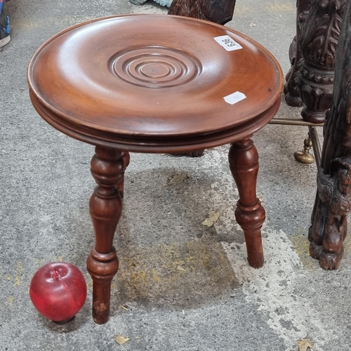 636 - A vintage turned wood plant stand with richly toned wood and a softly bevelled top. An ideal example... 