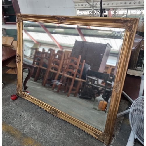 640 - Star Lot : A very large over mantle mirror housed in an elegant Regency inspired gilt frame with sca... 