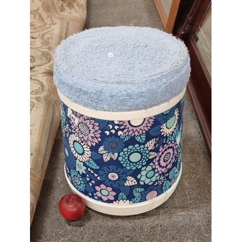 649 - An unusual retro storage stool. Featuring a plush baby blue seat and large stylised floral print in ... 