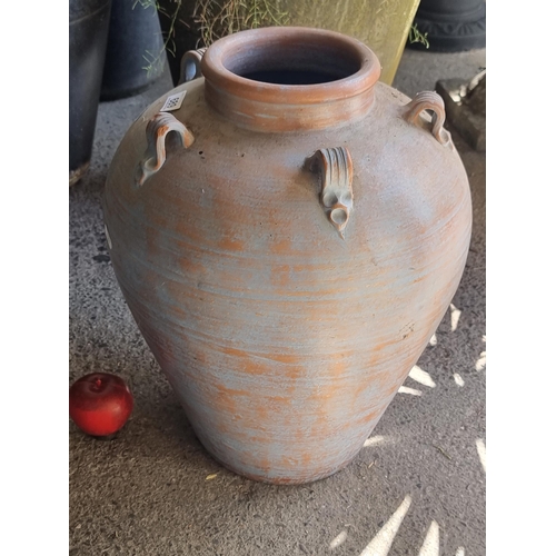 689 - A very large terracotta planter in the form of an urn with an attractive baby blue finish. H45cm