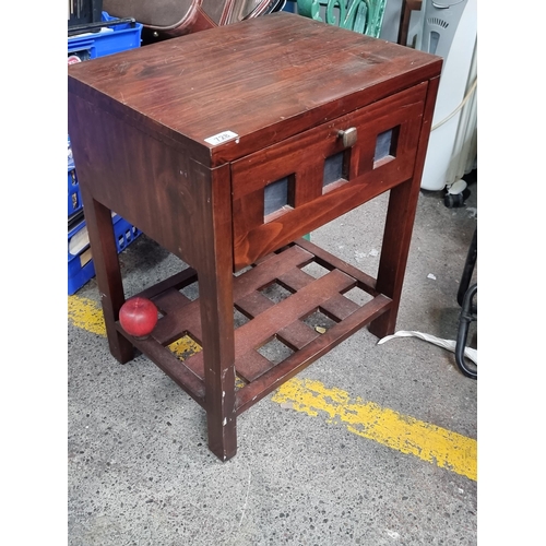 728 - A mahogany bedside cabinet  with lattice undertier and single drawer to front.