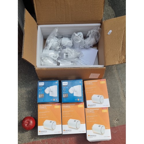 195 - A box containing 14 brand new/as new electrical fittings including a 12 smart radiator thermostat va... 