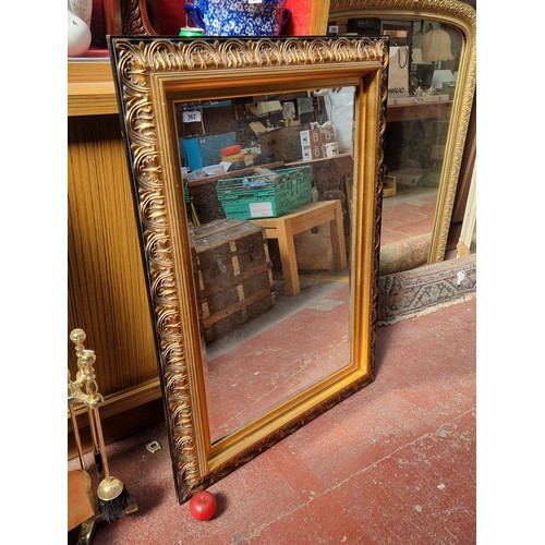 362 - A large Gallery Hythe branded wall mirror with antique style frame. Featuring acanthus leaf moulded ... 