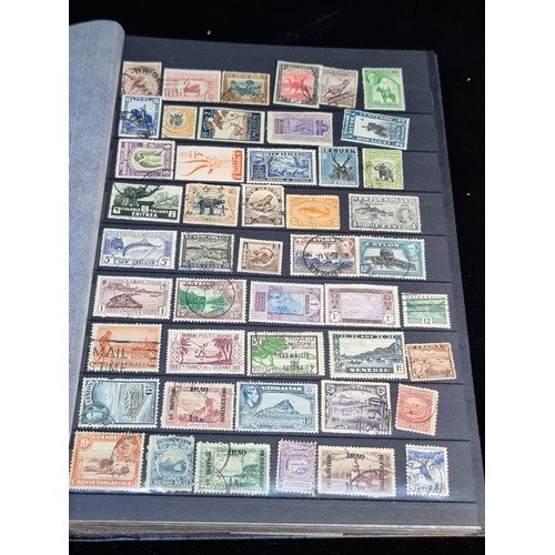 143 - A fabulous stamp album filled with 19th and 20th century global examples many in mint condition.