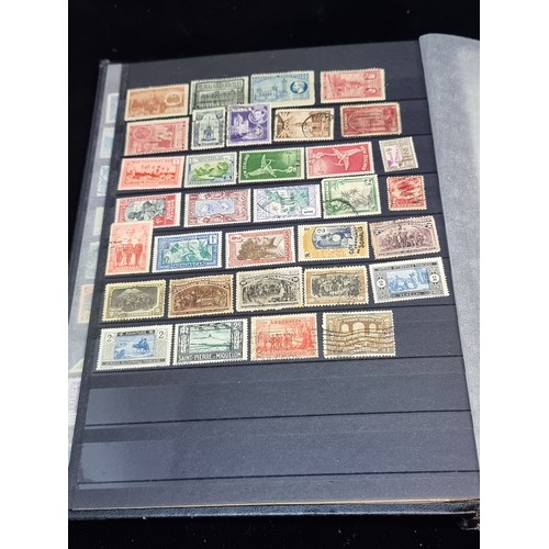 143 - A fabulous stamp album filled with 19th and 20th century global examples many in mint condition.