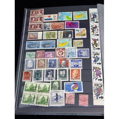 143 - A fabulous stamp album filled with 19th and 20th century global examples many in mint condition.