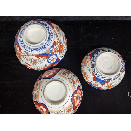 215 - Three charming vintage Imari pattern serving bowls. In various sizes and featuring floral designs.