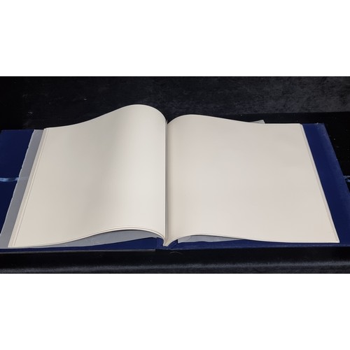 219 - A large Newbridge Silverware photo album with a reflective cover and blue plush lining. H36cm x L41c... 