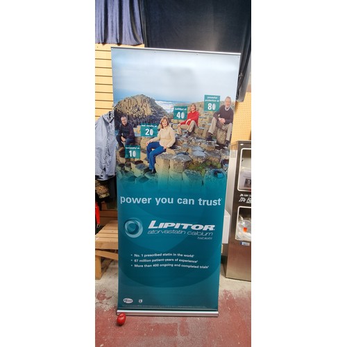 329 - A large roll-out display 'Mercury' banner from Clip Display Services. With a weighted base and origi... 