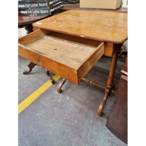 393 - Star lot : A very elegant golden satinwood antique sewing table with deep pull-out drawer. Supported... 