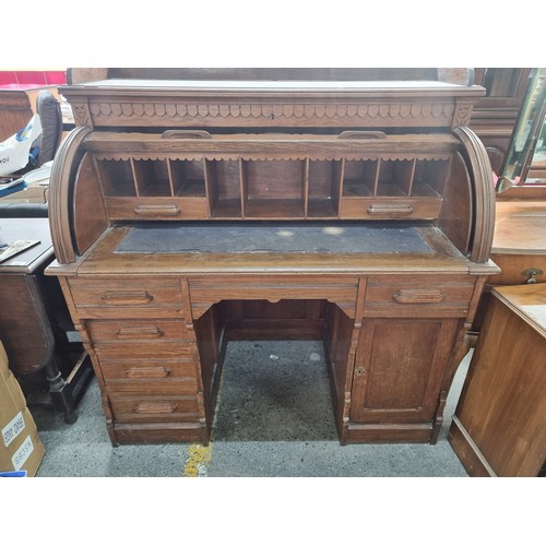 496 - Star Lot - A striking antique solid oak writing desk with a drop down shutter to top to reveal nine ... 