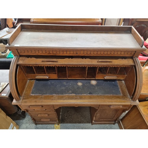 496 - Star Lot - A striking antique solid oak writing desk with a drop down shutter to top to reveal nine ... 