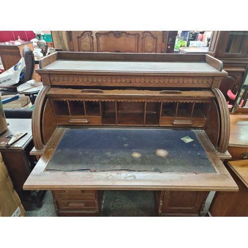 496 - Star Lot - A striking antique solid oak writing desk with a drop down shutter to top to reveal nine ... 