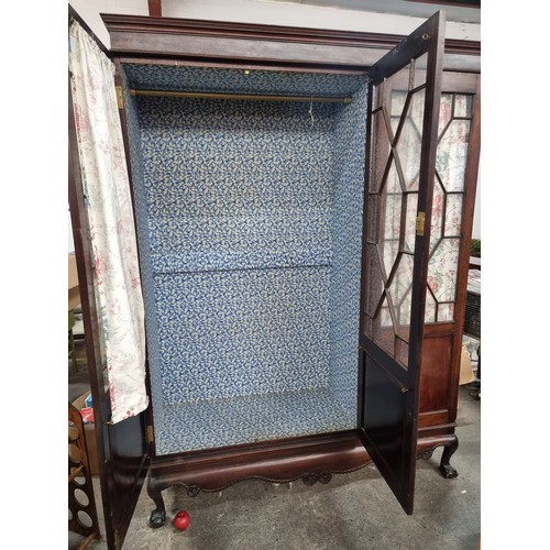 618 - Star Lot : A handsome Victorian mahogany triple wood wardrobe. An unusual glaze fronted example with... 