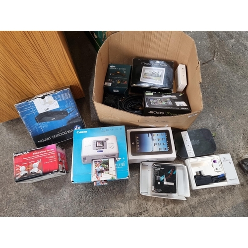 602 - A mixed lot of electrical items in original boxes including a Canon Selphy CP-720 photo printer, A N... 