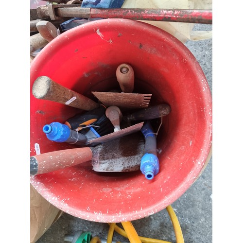 654 - A HoZeLock garden hose reel with a large quanity of mixed tools including spanners chisels, a German... 